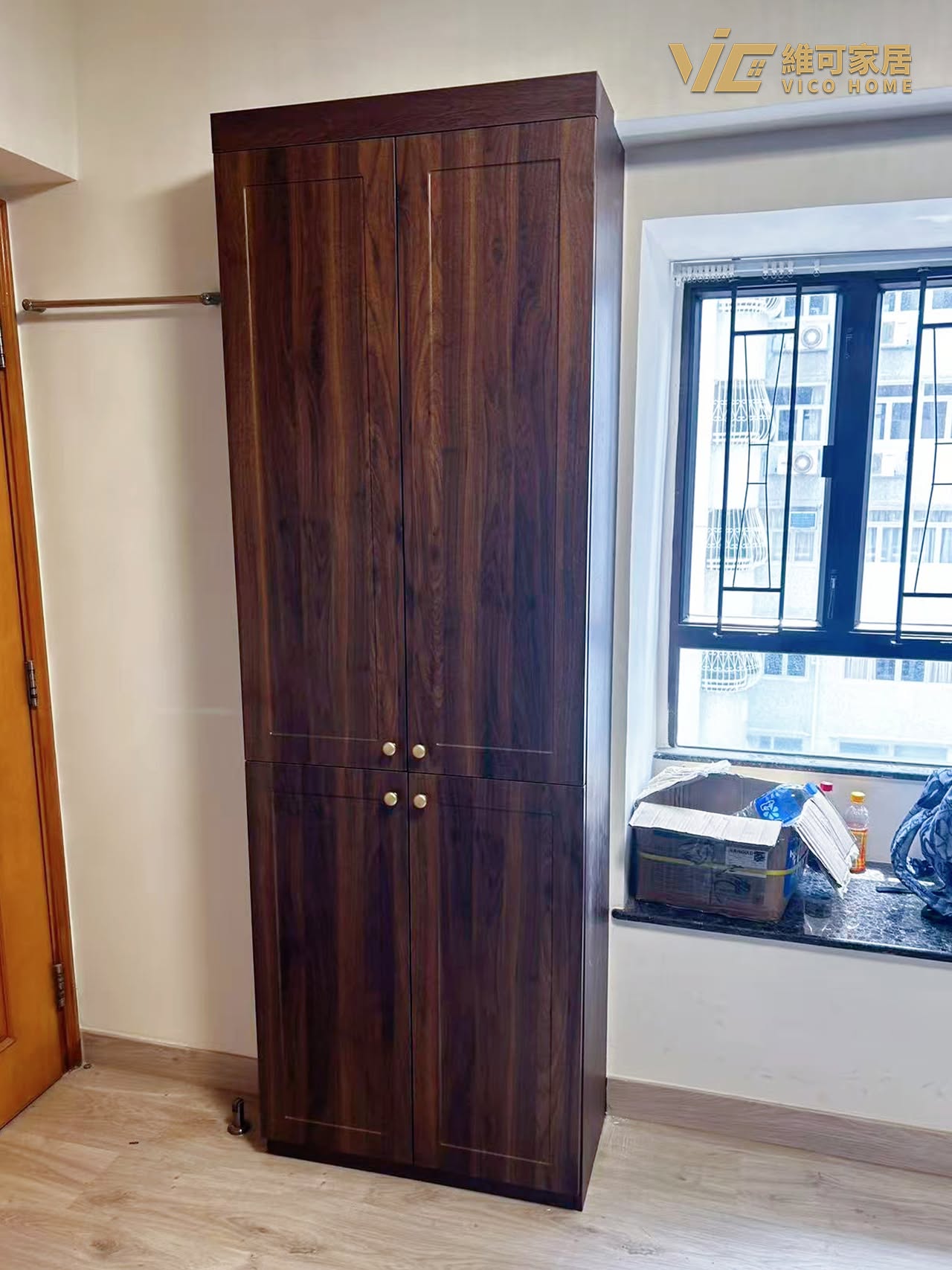 custom-wardrobe-design 18 Taikoo Shing dark wood shaker doors wardrobe with window bay trim