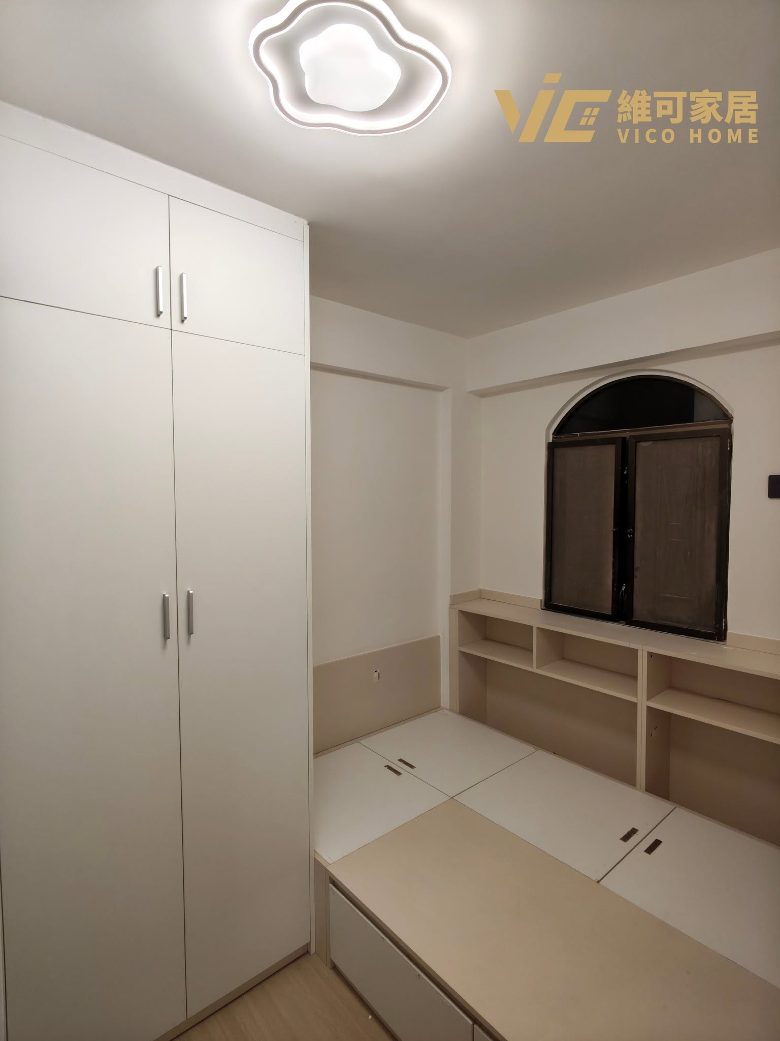 custom-wardrobe-design 3 Hong Kong small bedroom fitted wardrobe | White matte doors with arched window cutout