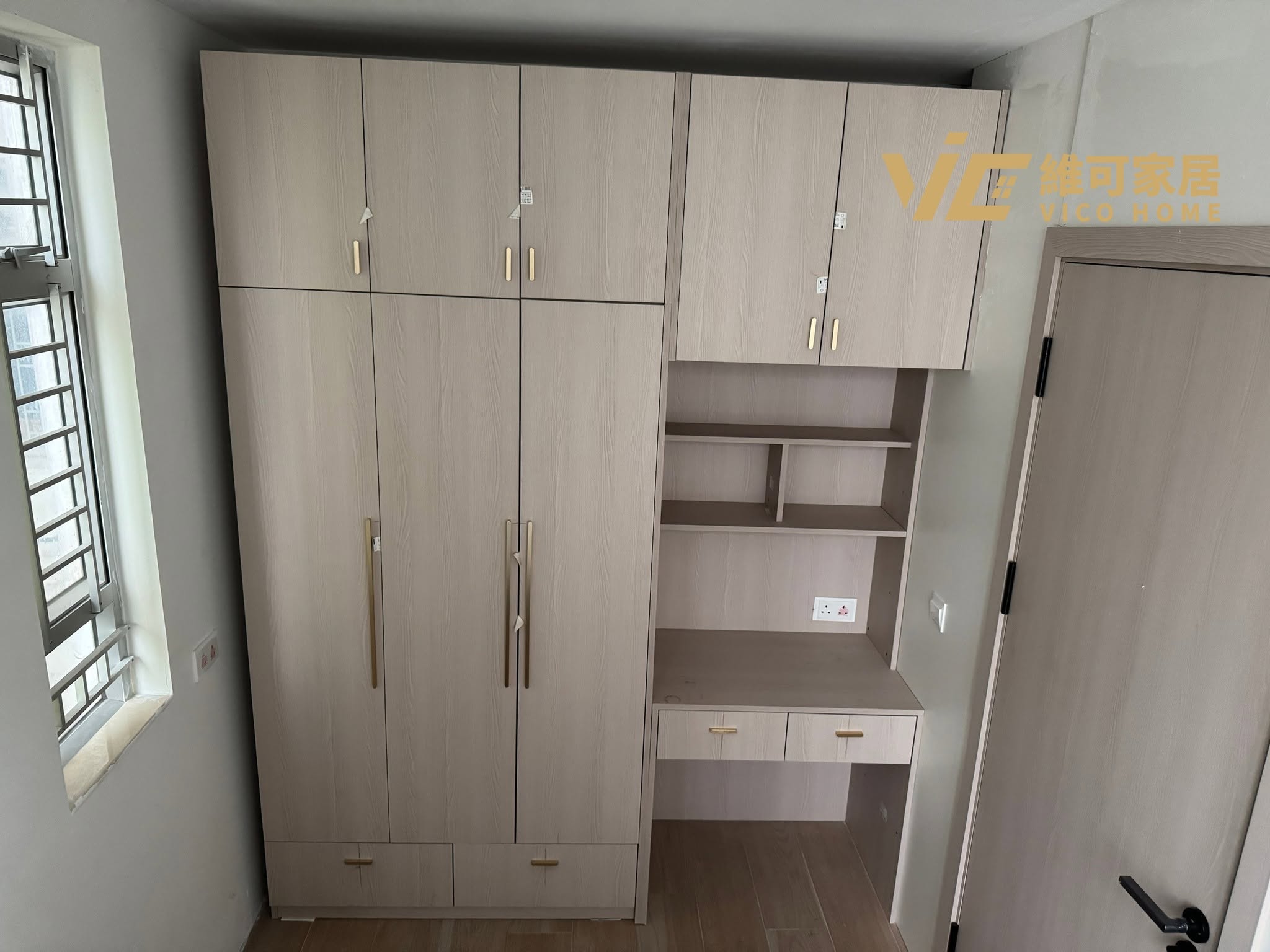 custom-wardrobe-design 4 Integrated wardrobe with floating study desk in HK | Light woodgrain doors with gold handles