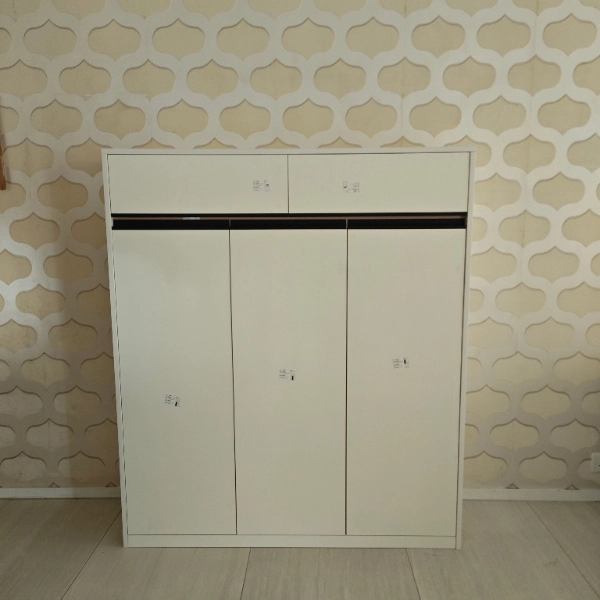 White three-door cabinet with two small drawers above
