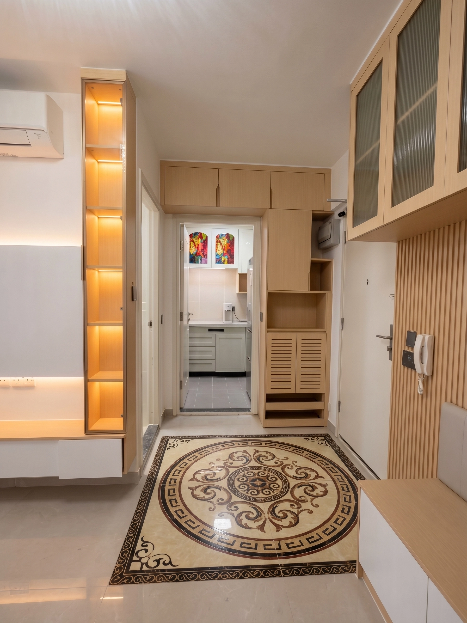 Yu Hing Court foyer corridor: Full-height illuminated storage unit, wood paneling, and patterned floor tiles