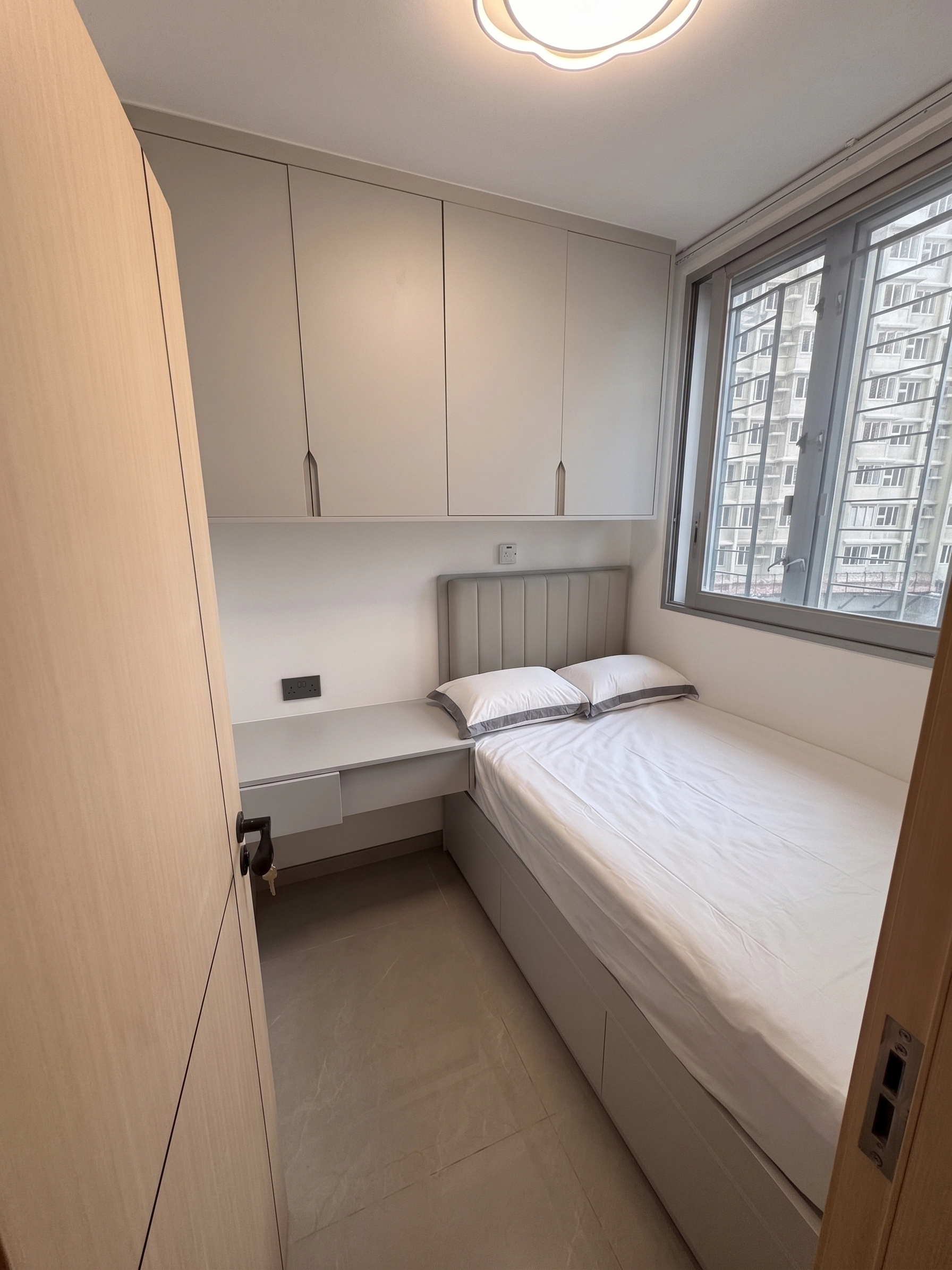 Yu Hing Court secondary bedroom: Full-height wardrobe integrated with nightstand
