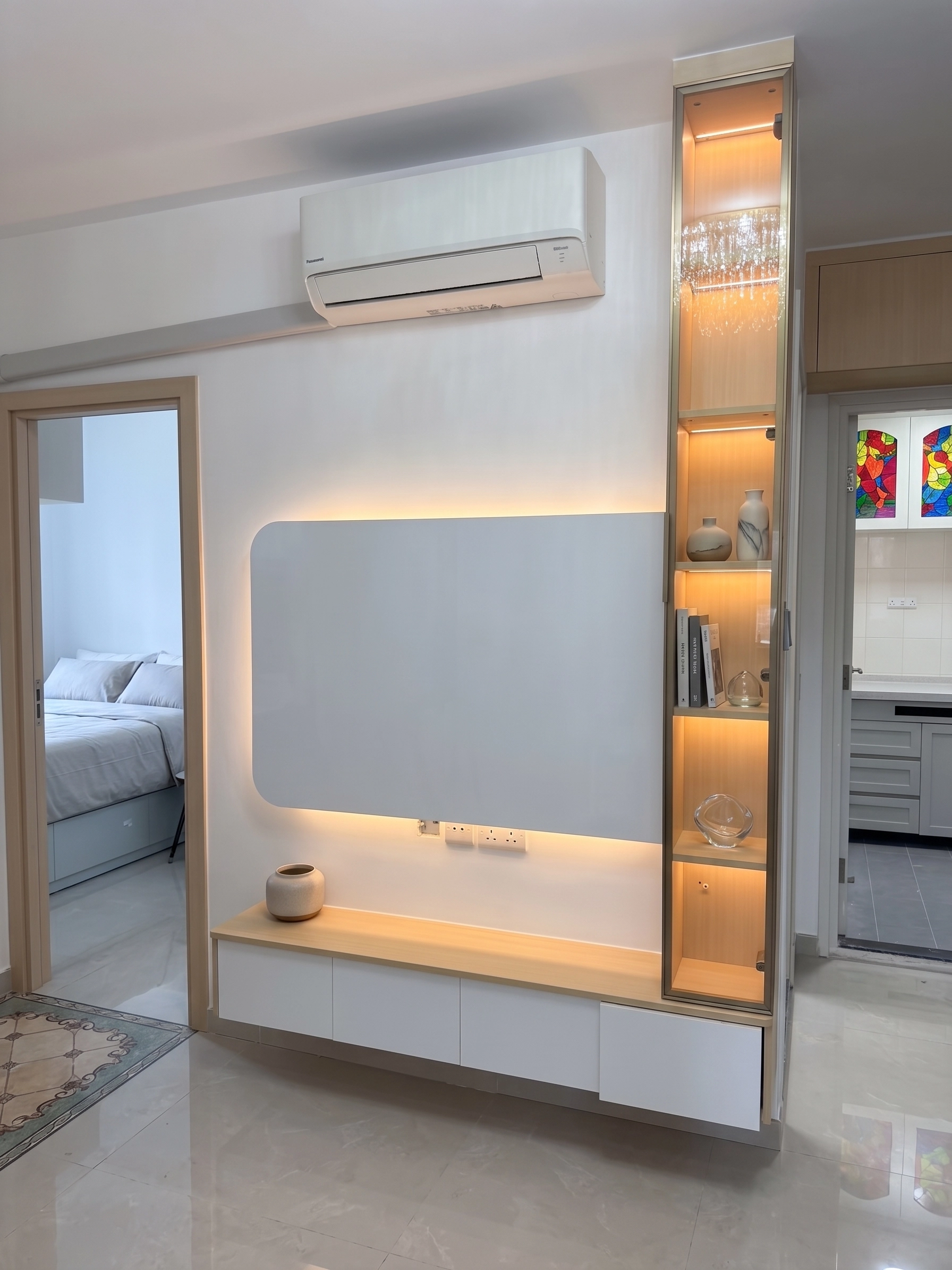 Yu Hing Court living room: Natural wood TV feature wall with built-in storage cabinets and warm LED accent lighting